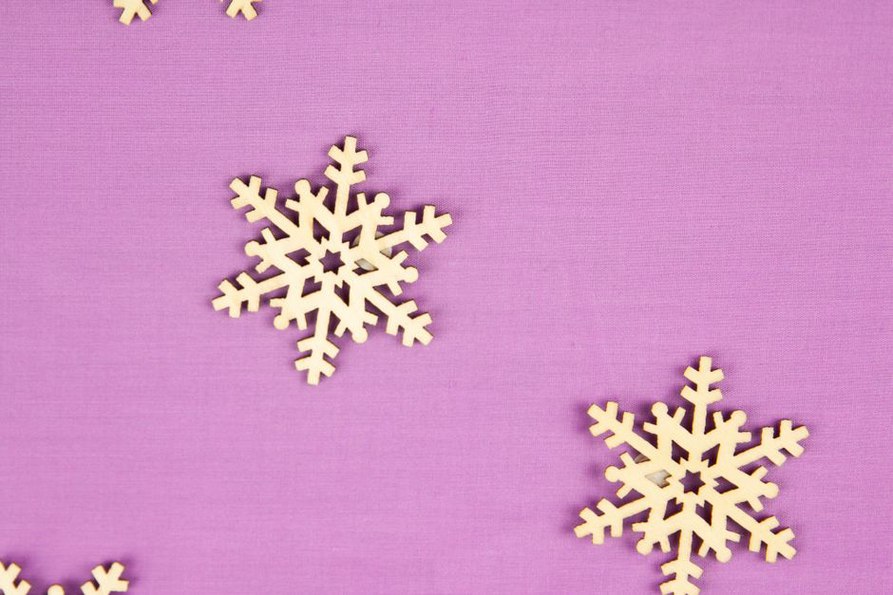 Pastel pink polystyrene barrette with embossed snowflake pattern