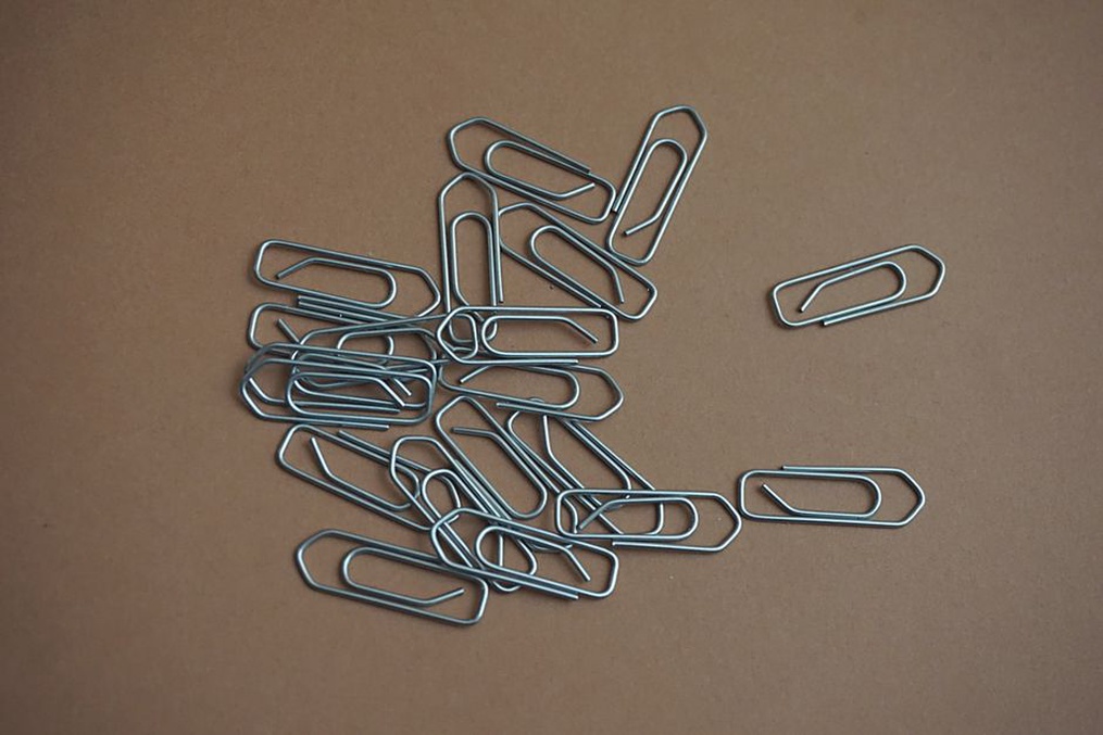 reverse of a beret hair ornament showing its metal clip