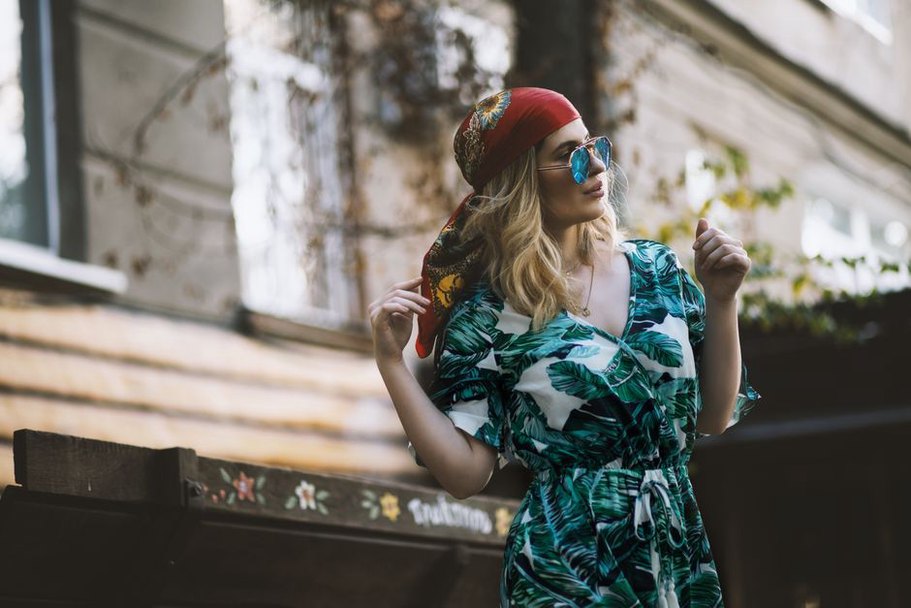 Woman in a floral maxi dress with a tortoiseshell side comb, 1970s