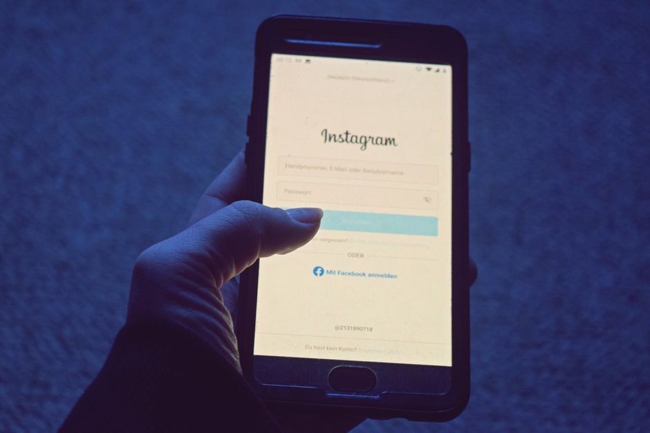 mobile login screen with a celluloid comb in the background