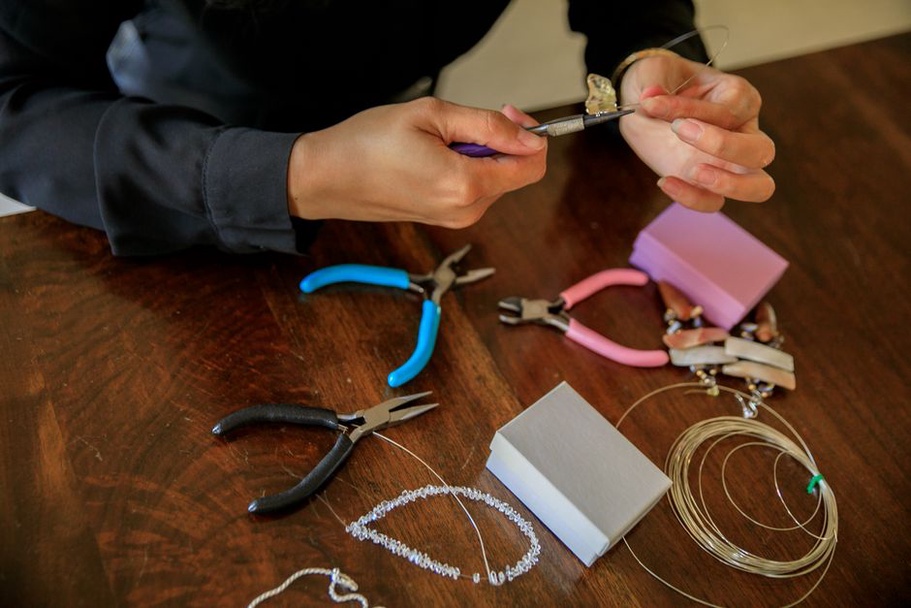Hand-wired beads and charms on a vintage hair comb