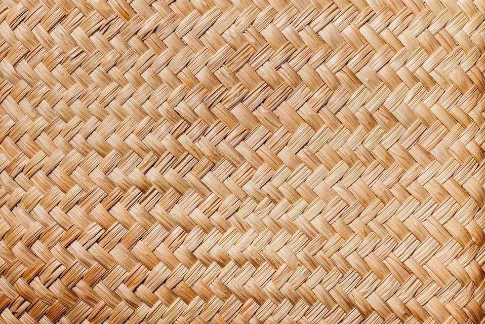 Close-up of handwoven straw texture on a vintage hat