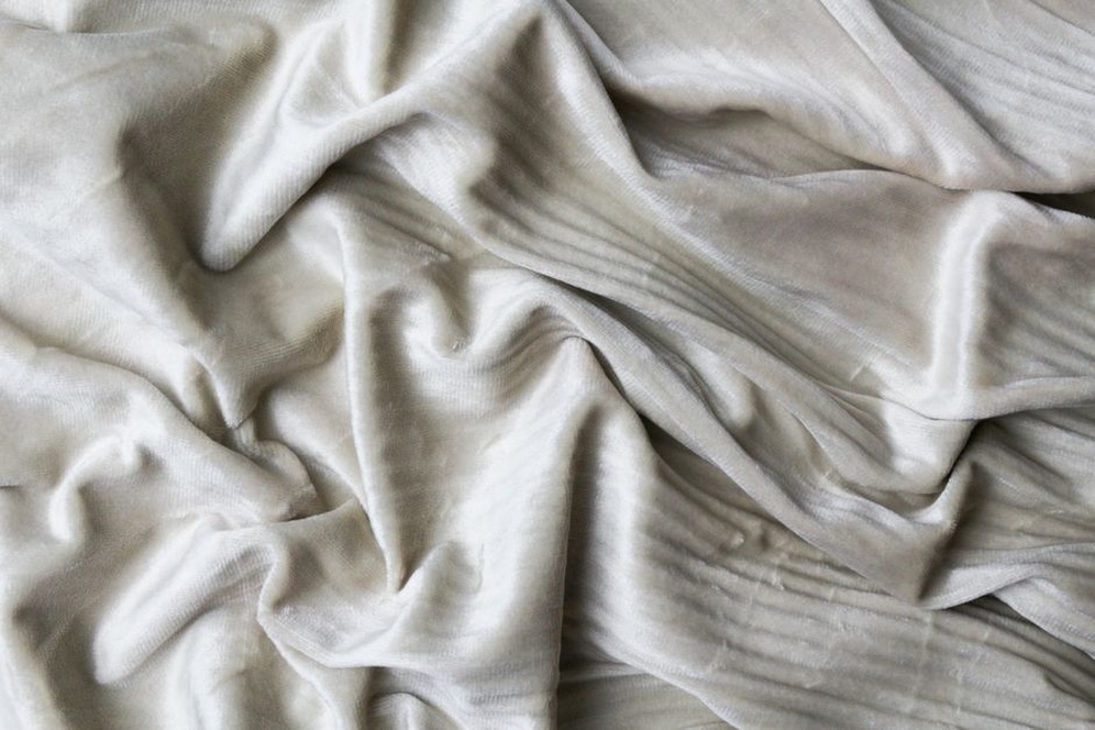 Close-up of velvet fabric on a vintage scrunchie, showing nap and weave