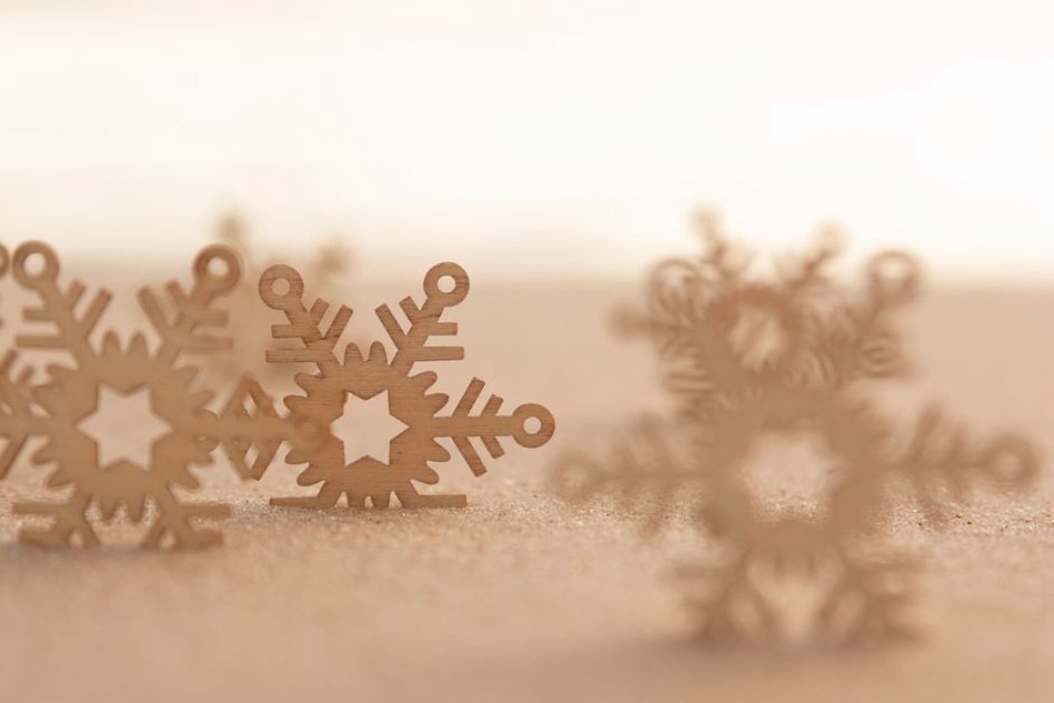 Enamel snowflake hair clip showing cold enamel finish and patina