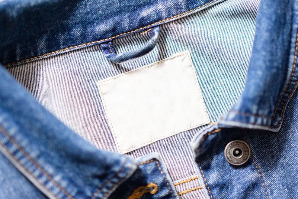 Close up of a 1960s t‑shirt collar with single‑stitch ribbing and a union label tag