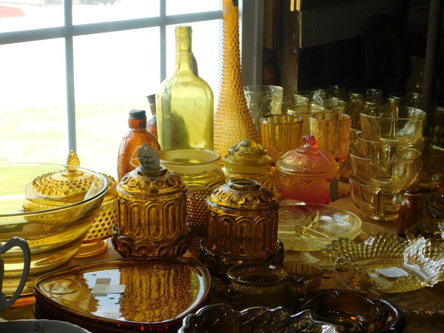 Amber and green vintage combs arranged on a wooden surface