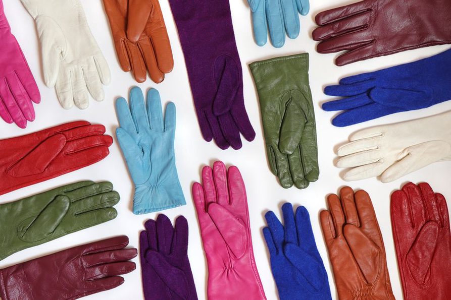 Dark velvet scrunchies arranged on a linen cloth for storage