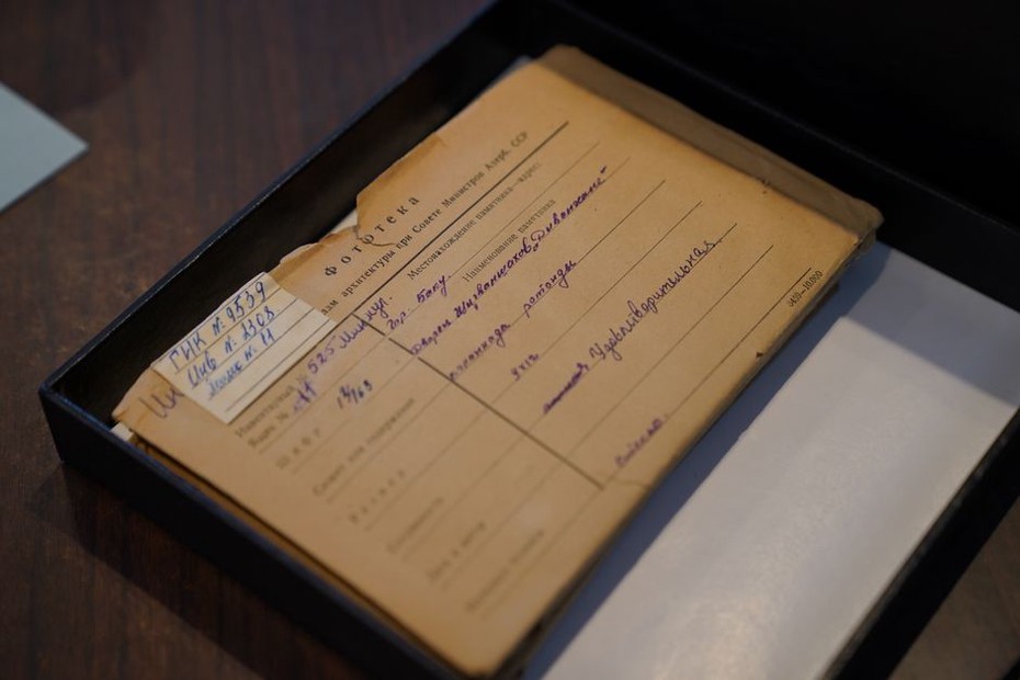 labelled vintage combs and ribbons in an archival storage box
