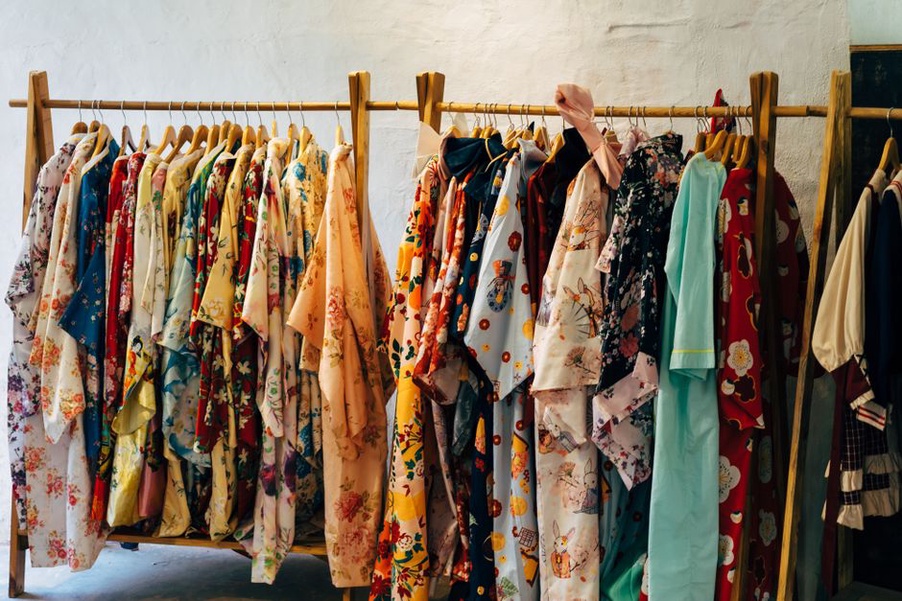 Silk kaftan storage alongside vintage hair accessories in a wardrobe