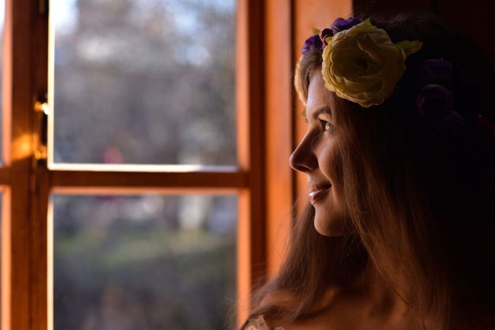 Silk rose crown headband from the 1890s displayed on a velvet bust form