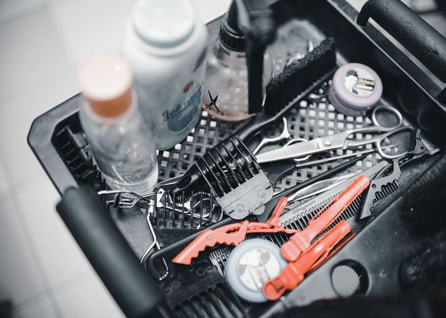 Celluloid combs wrapped in acid-free tissue inside a vintage leather jewellery case