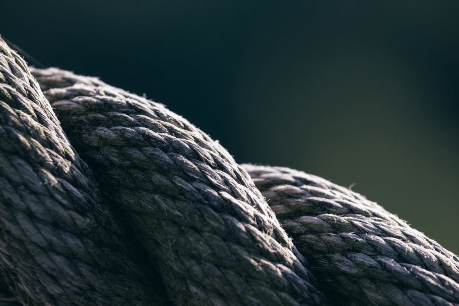 Close-up of six-strand tubular braid on a vintage headband showing rounded cord-like texture