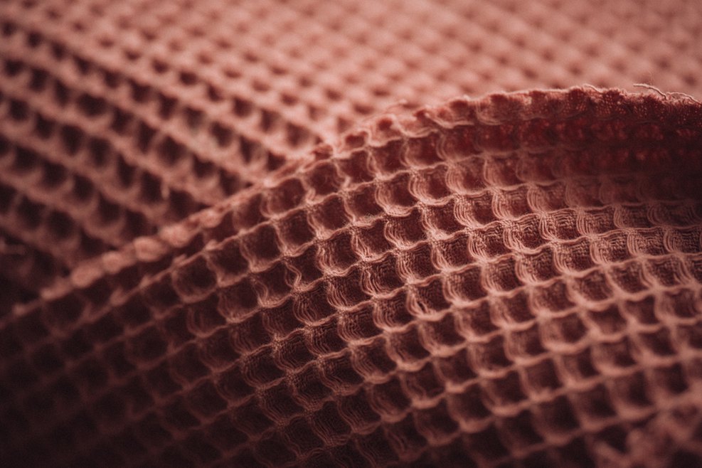 Celluloid combs in mocha shades displayed on natural linen