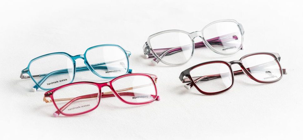 Four Asta flower clips in ruby, jet, pearl, and tortoiseshell
