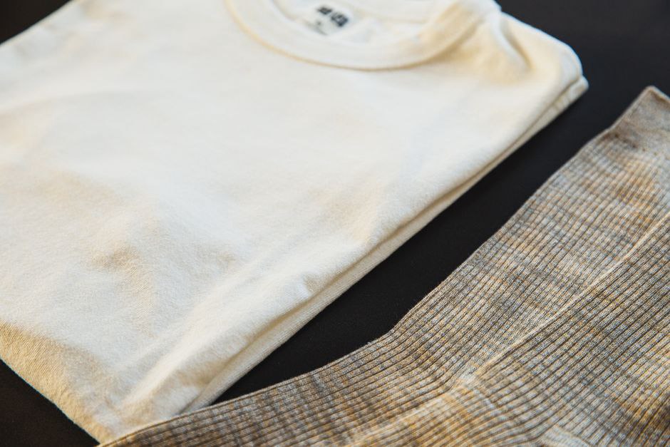 White vintage t-shirt with a tortoiseshell hair claw resting on the collar