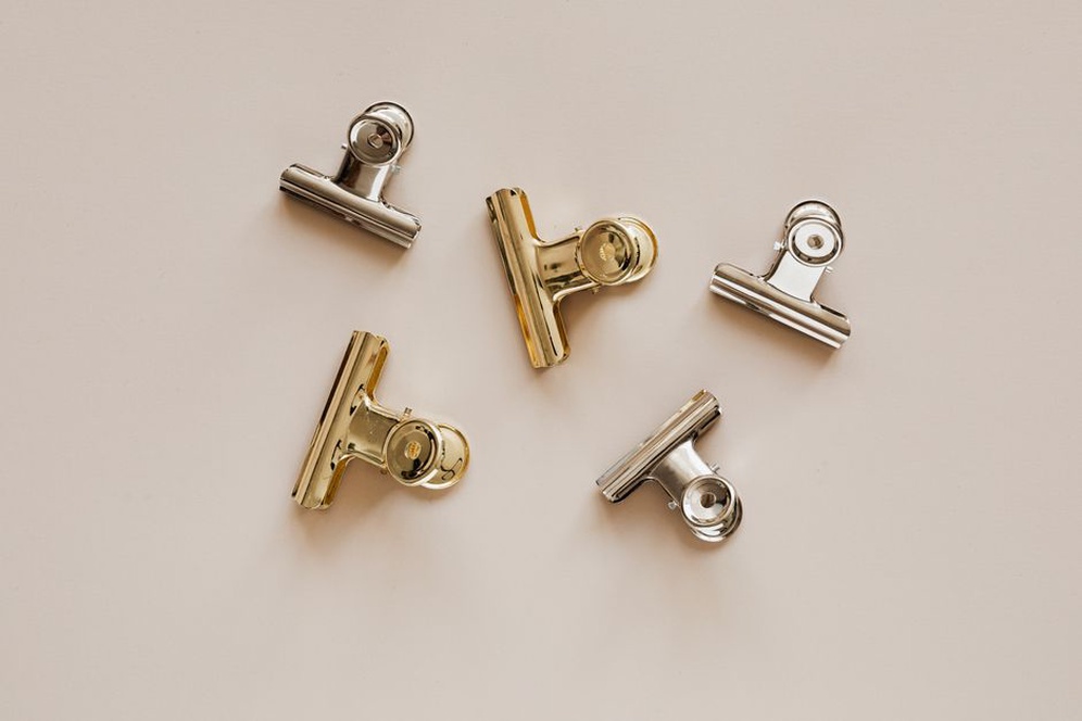 Collection of 1930s bakelite and celluloid hair clips on linen