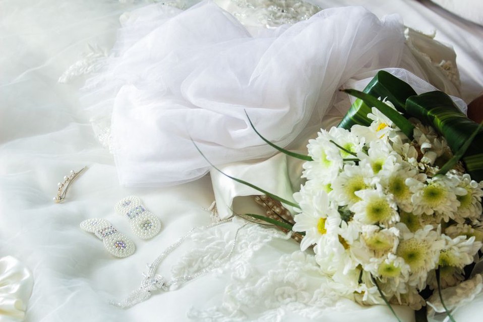 A flat lay of vintage hair clips from the 1920s to 1960s, grouped by decade