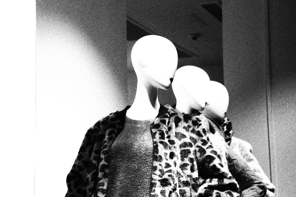 Leopard print headband styled with a cream blouse and tailored trousers
