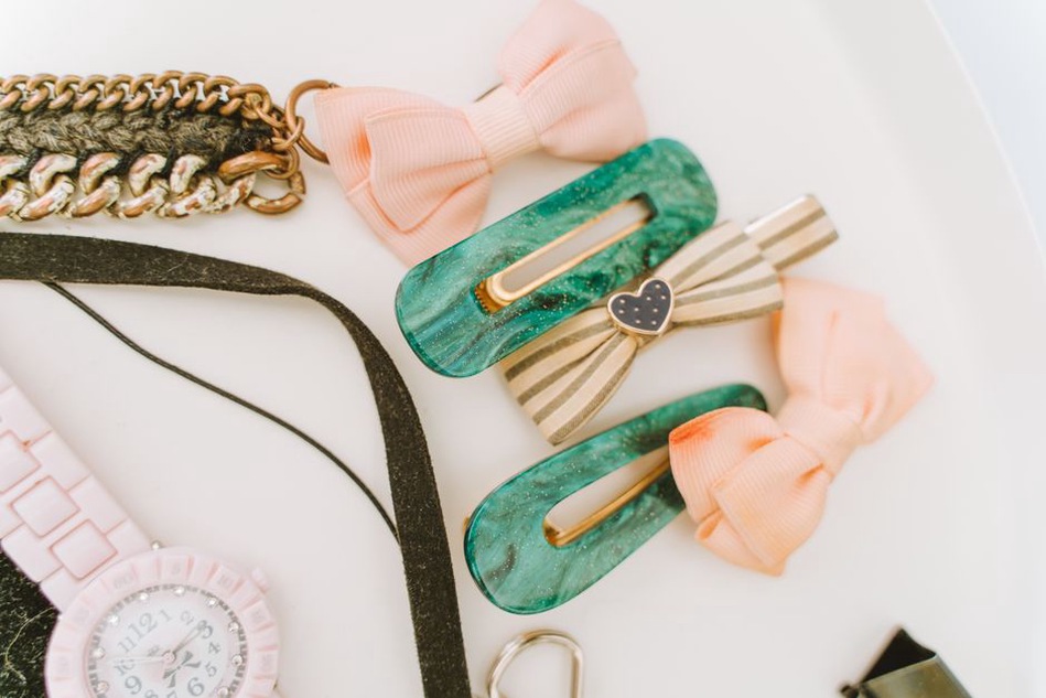 Caramel pearl bow hair clip resting on an antique dressing table