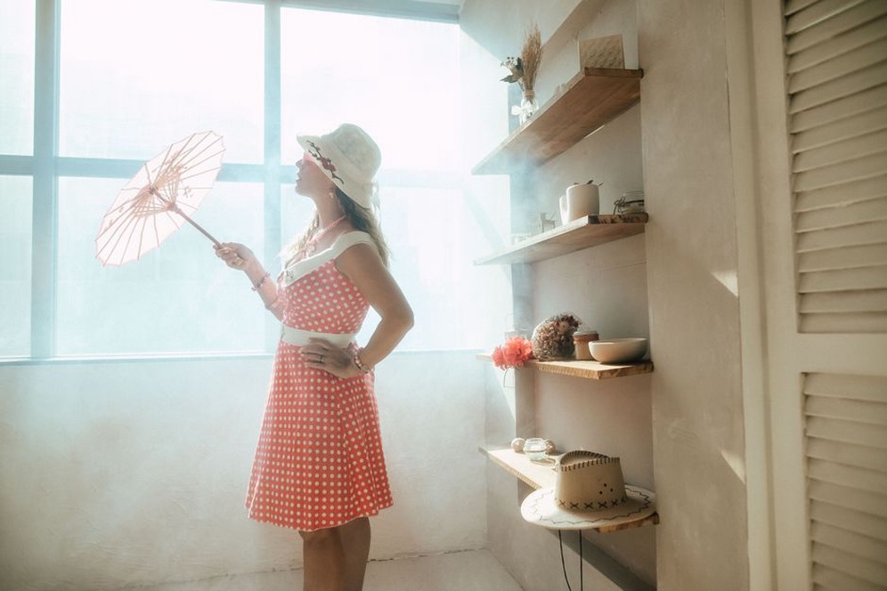 Vintage polka dot beret displayed on a mannequin head in soft studio light