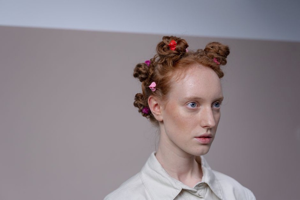 Ric rac hair clip in pale pink and white, resting on a 1950s sewing pattern