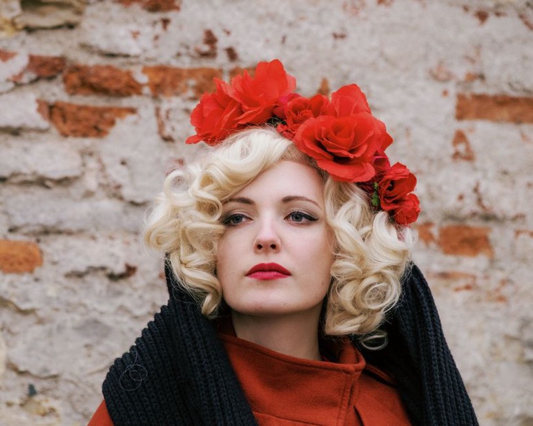 Edwardian-style rose crown headband displayed on a mannequin in a studio setting