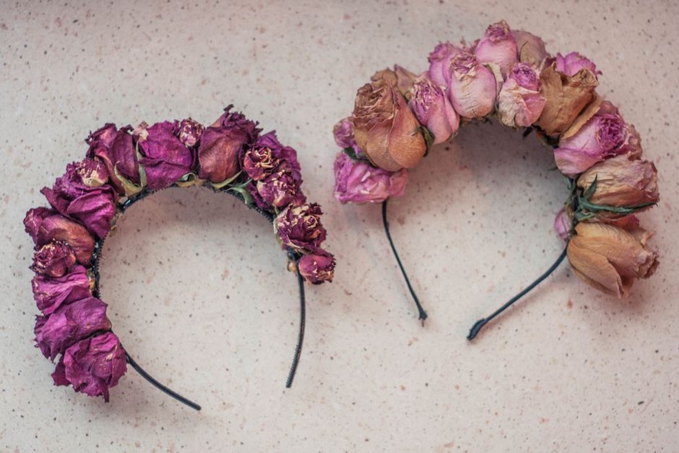 Close-up of a fabric rose headband with cream and pink petals