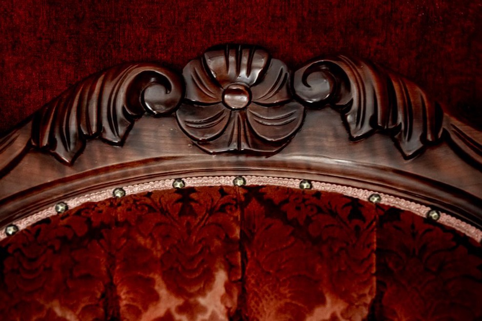 Tortoiseshell comb with carved teeth resting on velvet