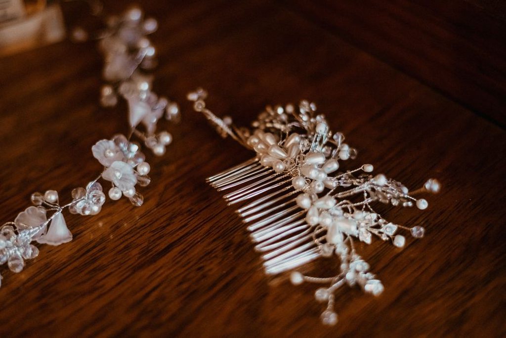A Victorian-era tortoiseshell hair comb resting on aged oak