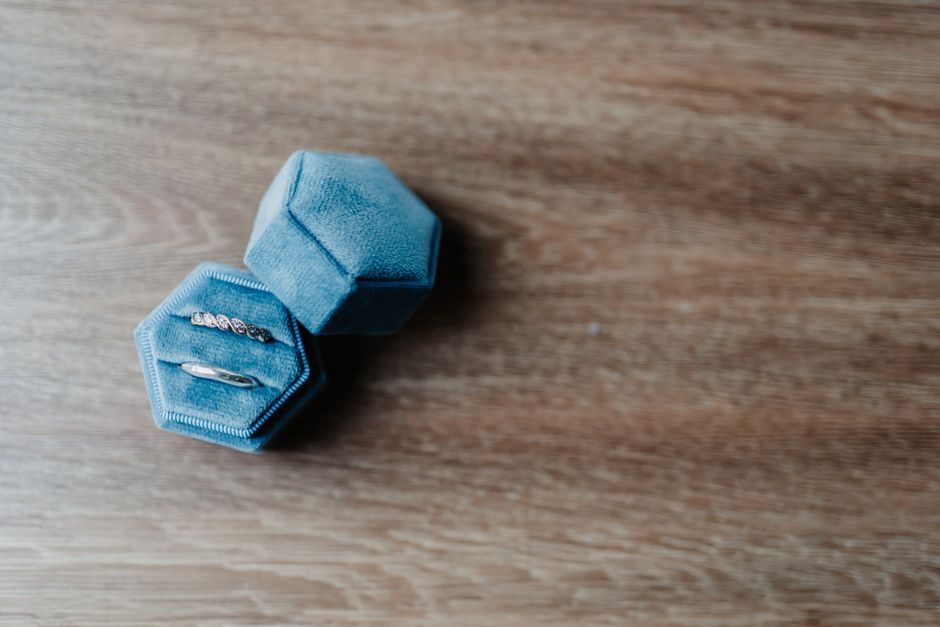 A Maison Archives velvet scrunchy displayed on an antique dresser