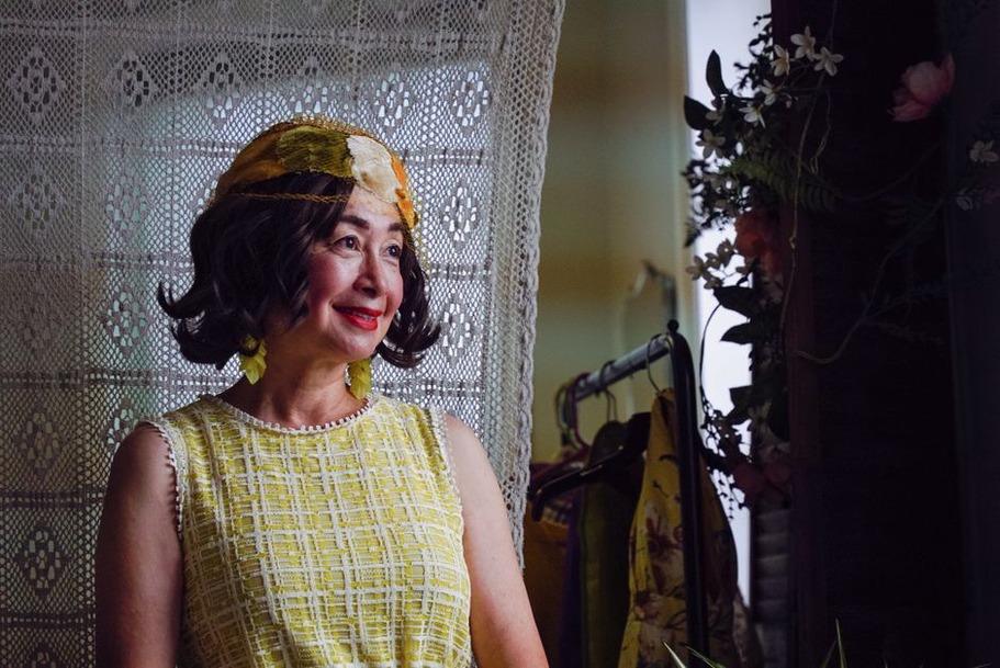 Styling a vintage lace dress with a pearl hair clip and velvet bow
