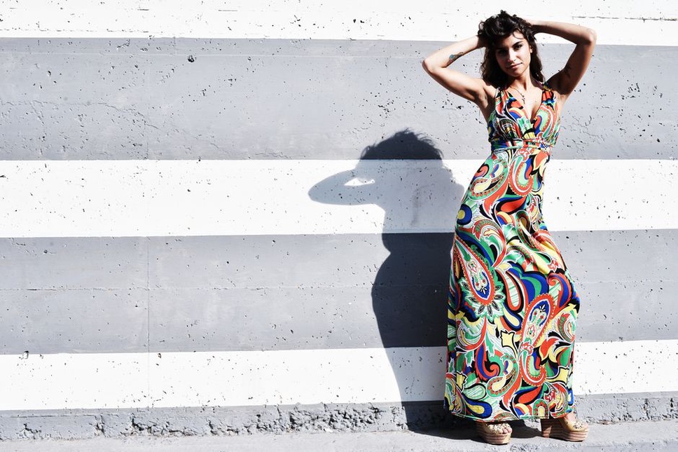Vintage-inspired styling with a long dress and a large tortoiseshell barrette