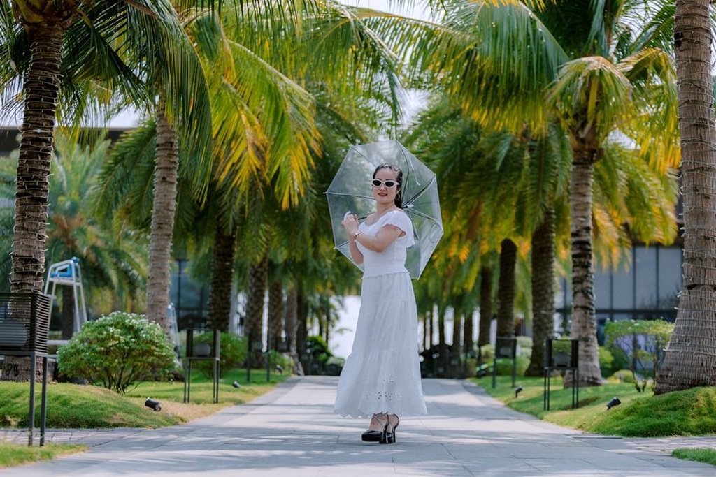 model in a flowing floral maxi dress with a rounded collar