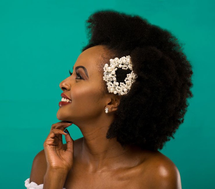 Pearl bow hair clip styled in a modern side-swept look