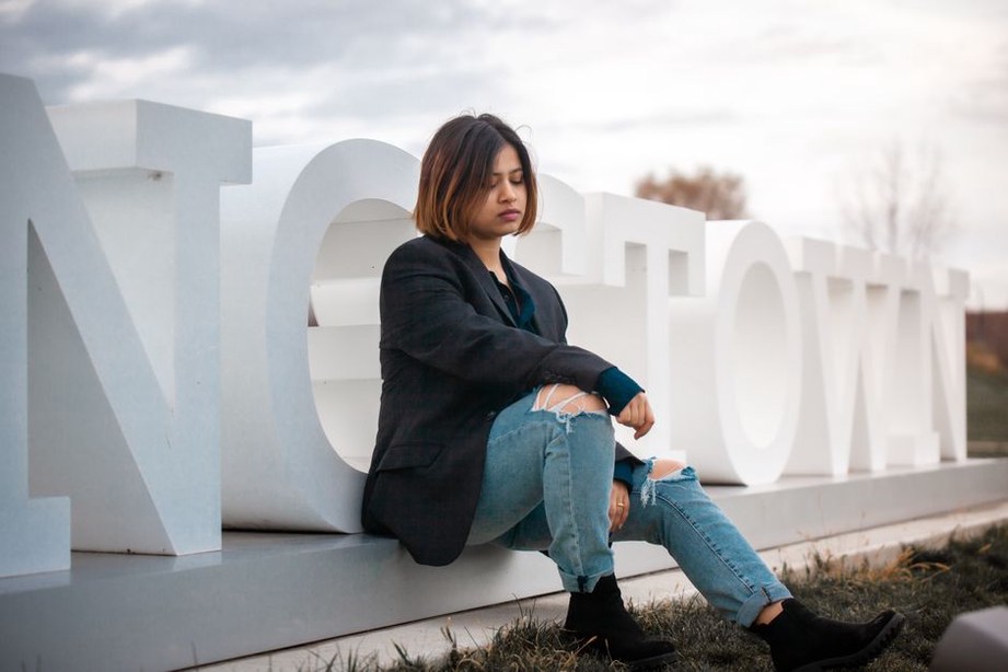 navy blazer paired with a velvet scrunchie in natural daylight