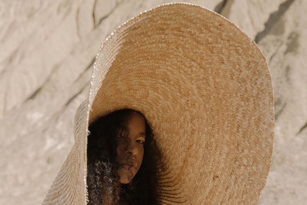Oversized straw hat in a sunny British garden setting