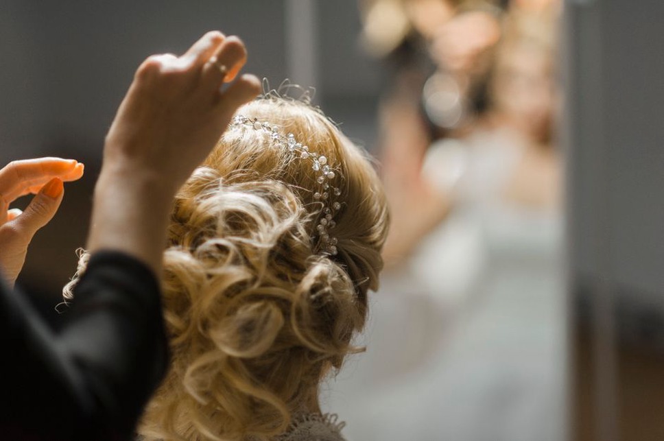 Vintage-inspired hairstyle with pearl comb accent at the nape