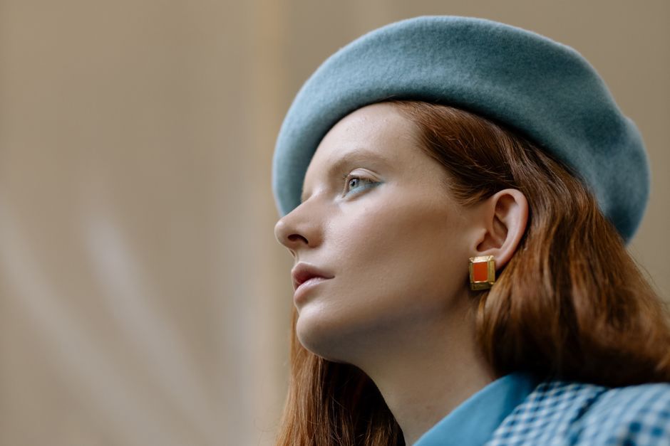 Vintage gold and lapis earring used to adorn a classic low bun hairstyle