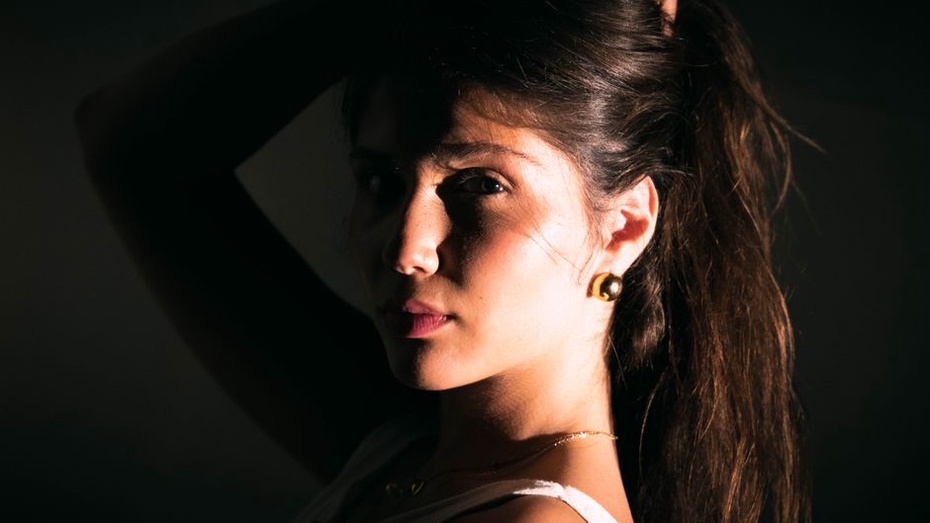 double sun earring styled as a hair accessory with a velvet scrunchie