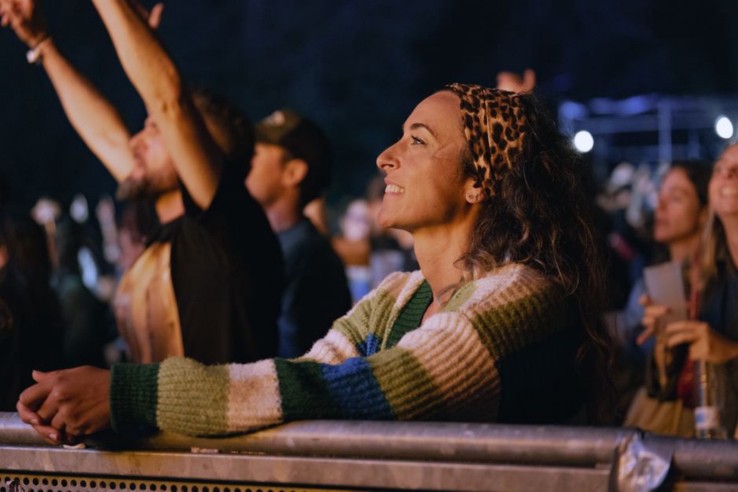 Crowd at Woodstock with leather headbands and flowing hair