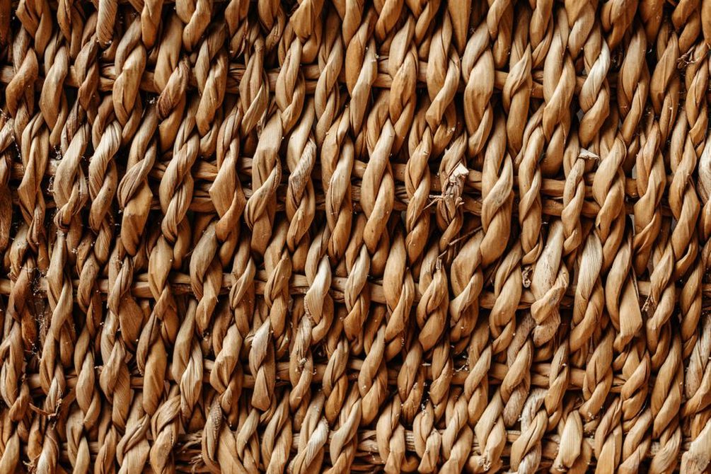 Close-up detail of handwoven cane used in vintage basket bags