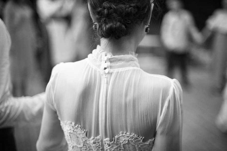 Black lace comb paired with understated tailoring