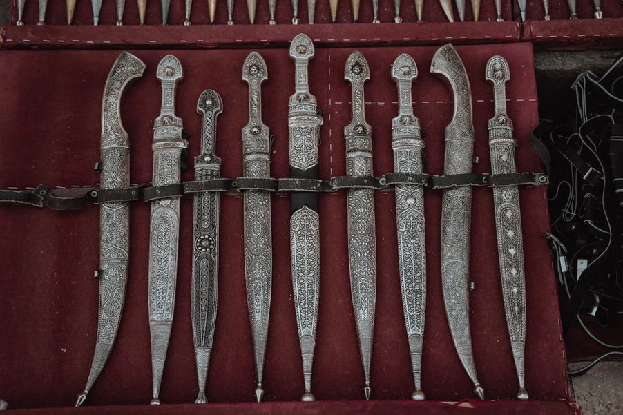 Ornate pin heads above long tapered prongs