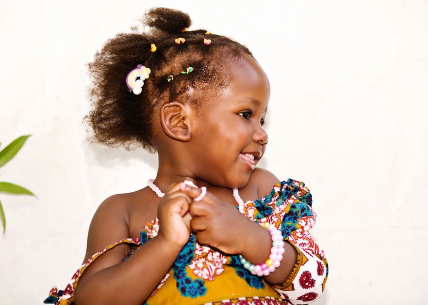 A beaded clip adds detail to a simple hairstyle