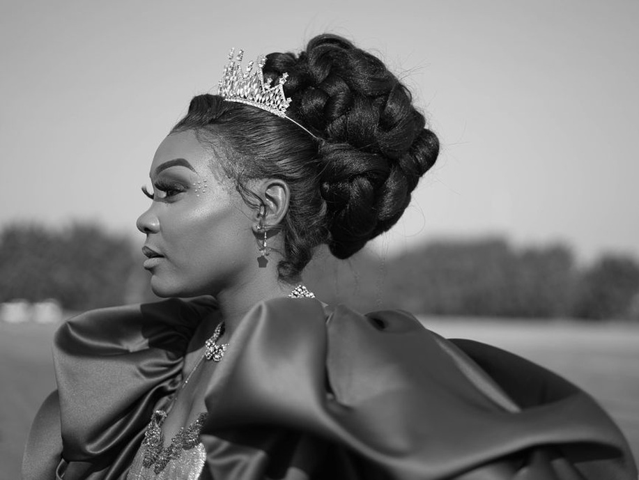 A delicate tiara above a sculpted updo