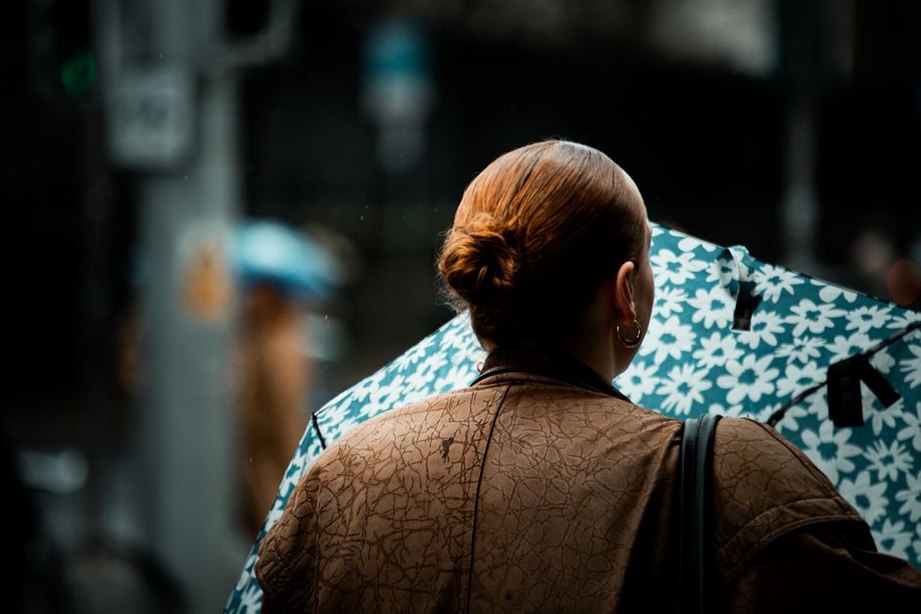 Floral comb peeks above a neatly pinned bun