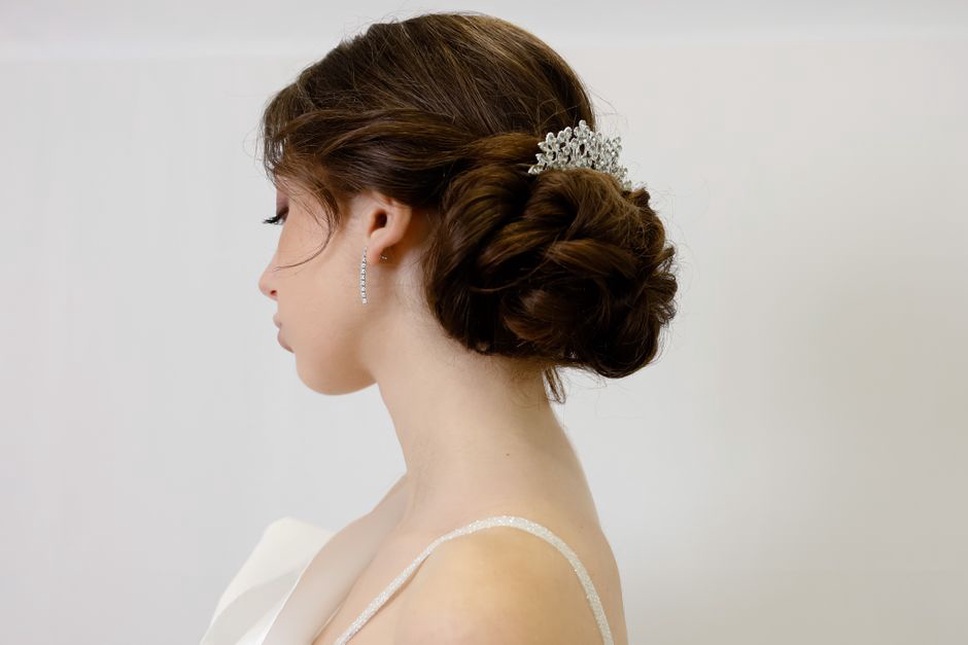 A high tiara rises above a bridal updo