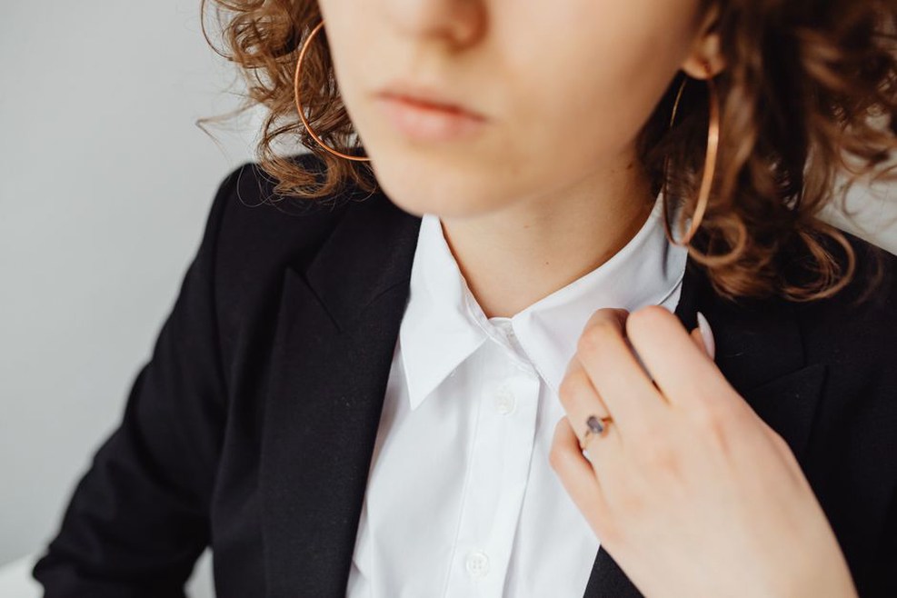 A dark bow adds shape to modern tailoring