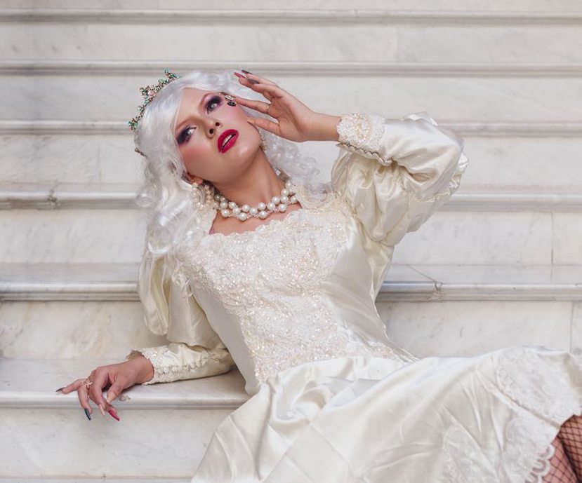 Pearls and a tiara frame a formal hairstyle