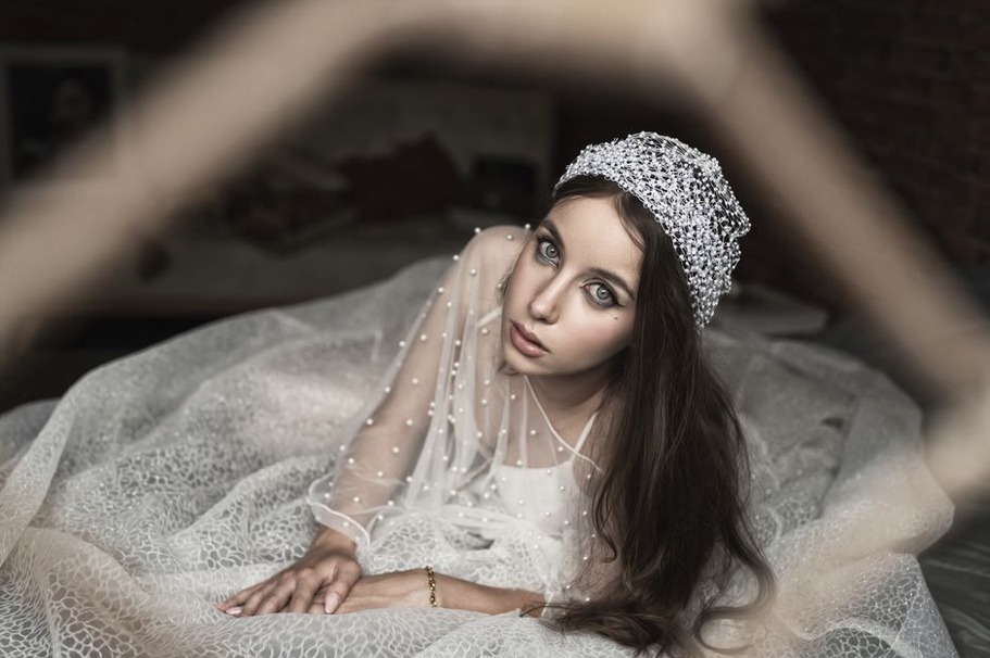 Small beads spaced across a delicate hairnet